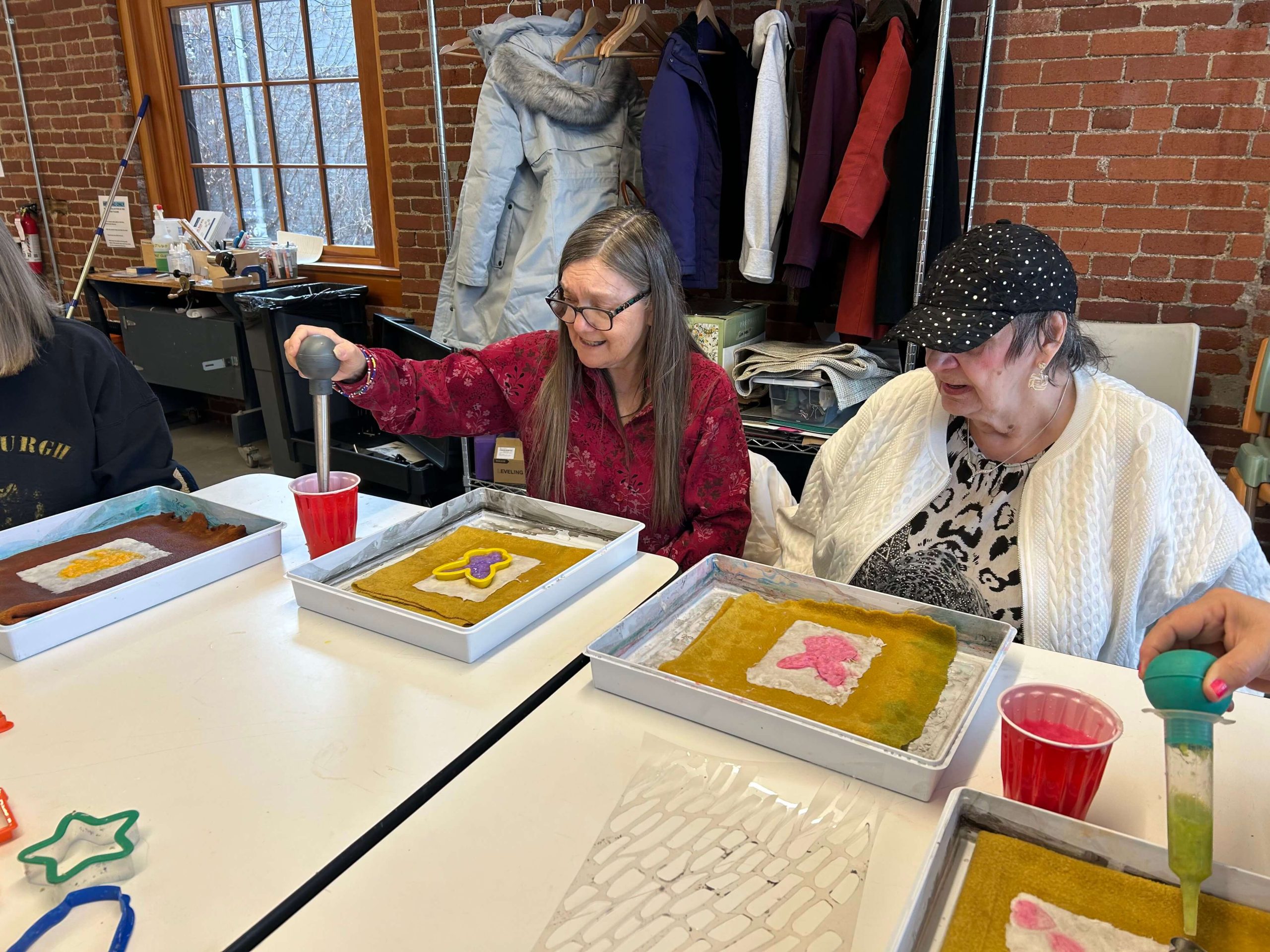 Two people crafting together at a table