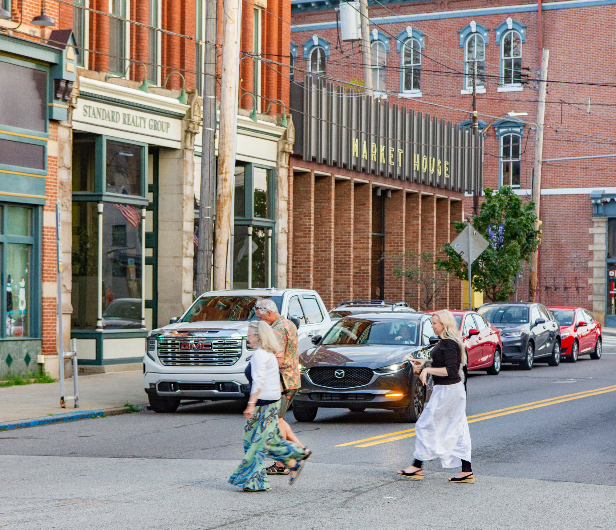 Three people crossing butler street